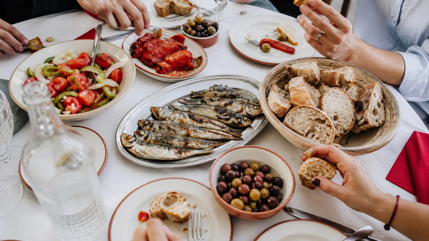 Portuguese shared plates across a lively table